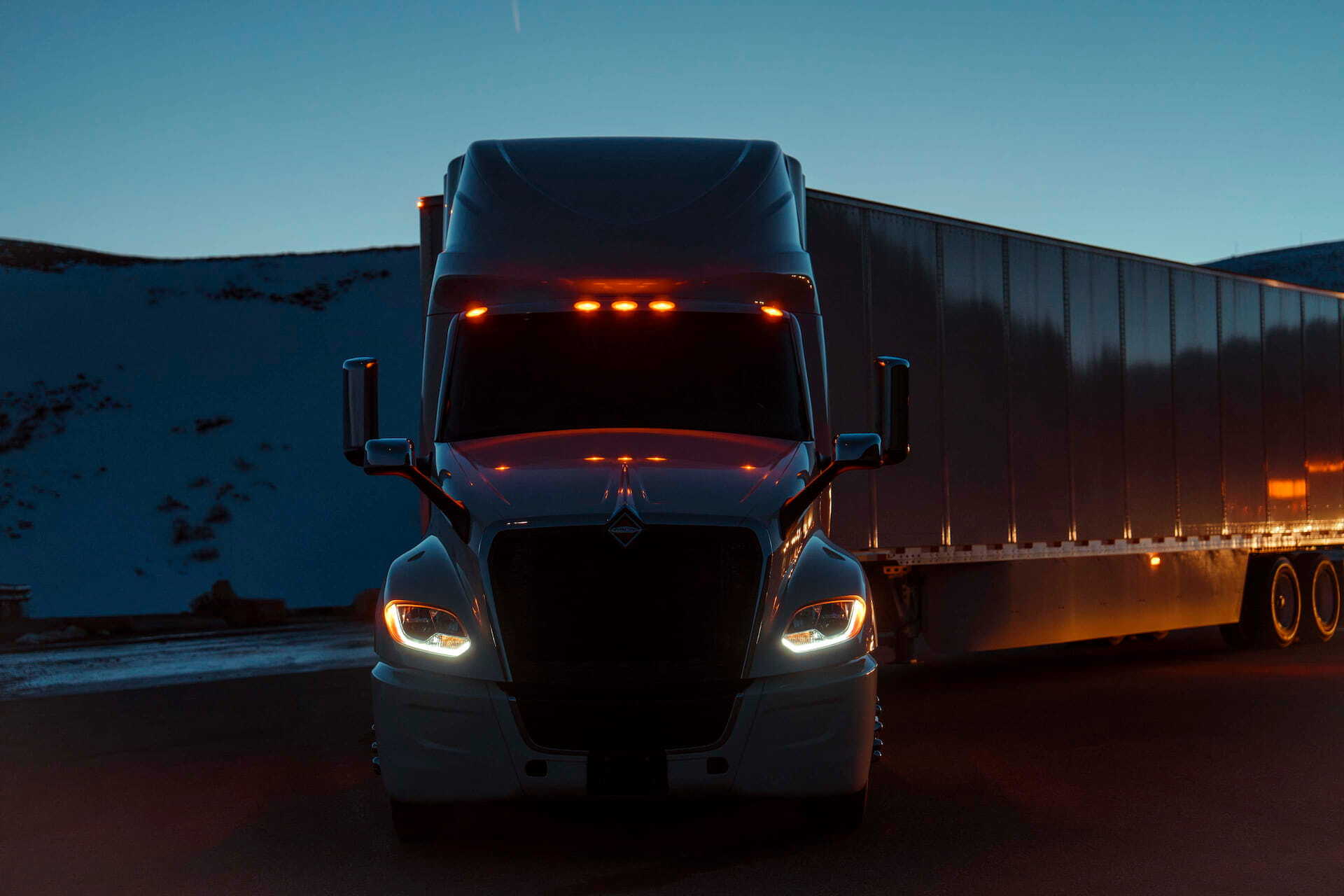 international-LT-foreground-front-parked-nighttime-snowy-mountains-rest-stop
